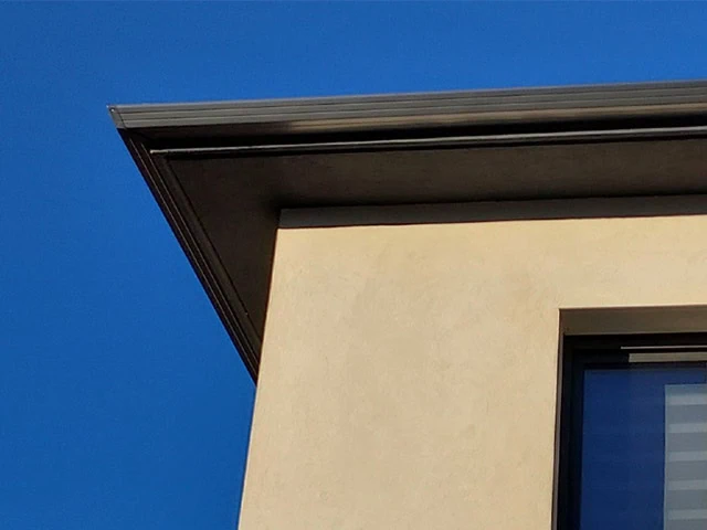 Boîte à eau et couvertine pour muret pour un bâtiment à toit plat